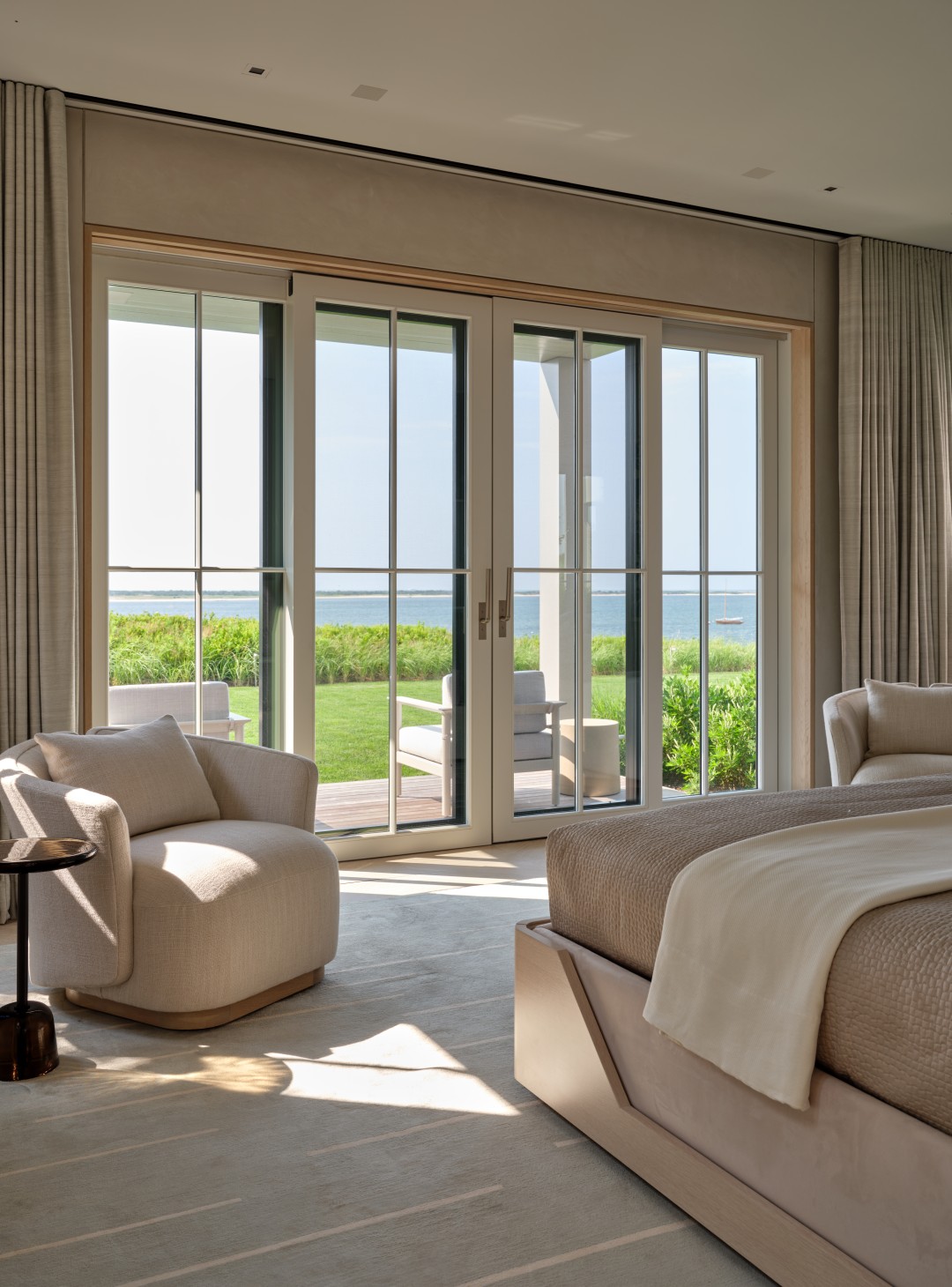 Bayfront estate living room with ocean views and concealed home technology